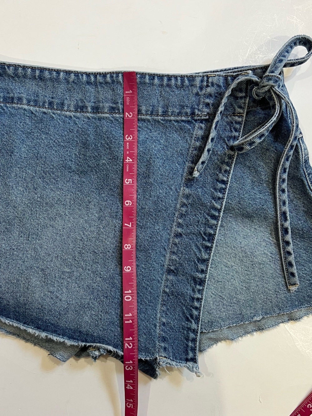 Free People Emmy Denim Faux Wrap Mini Skort with Side Tie - Picture 11 of 12